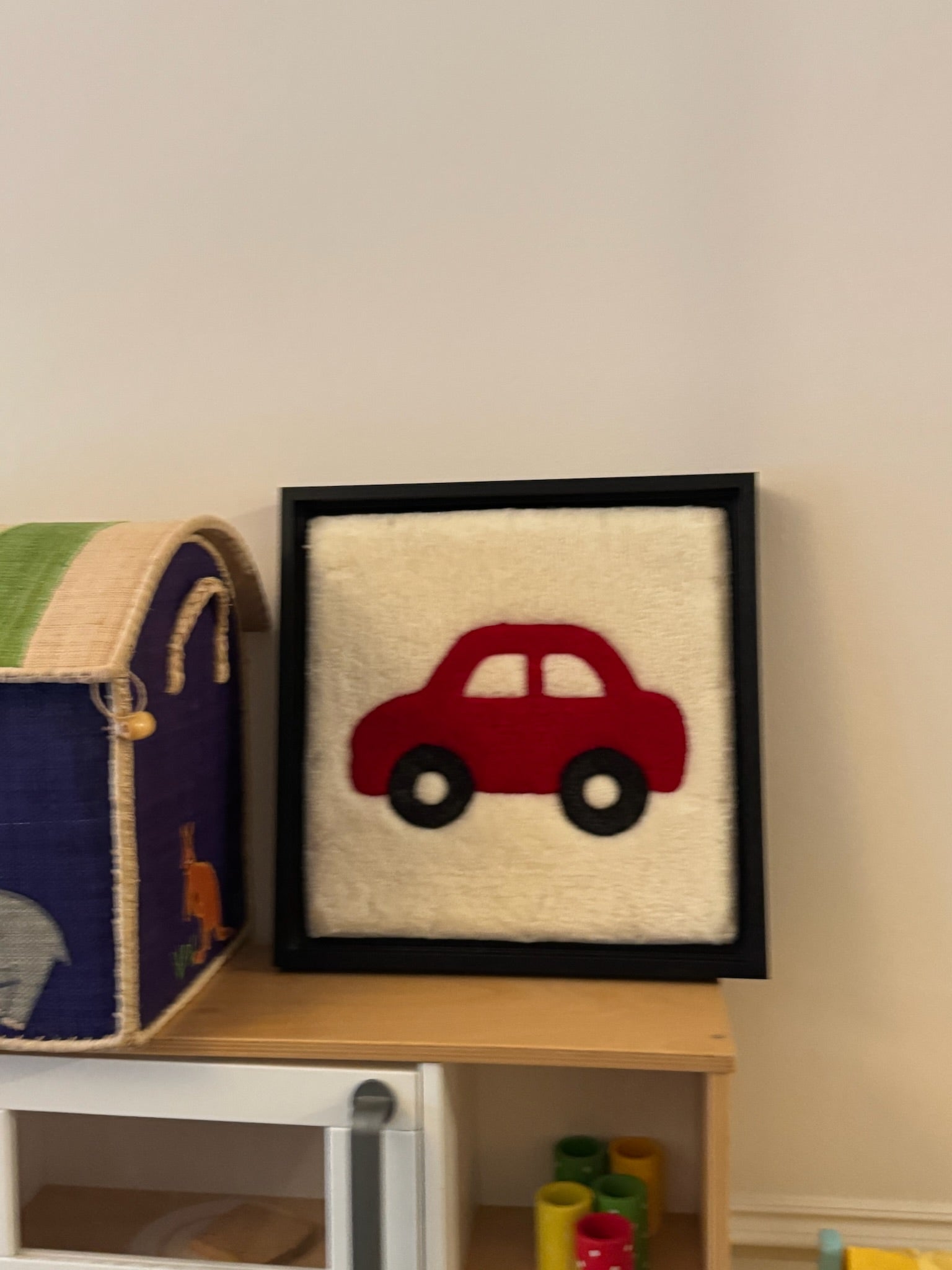Hand-tufted wall art. Car red in wooden frame. 30x30