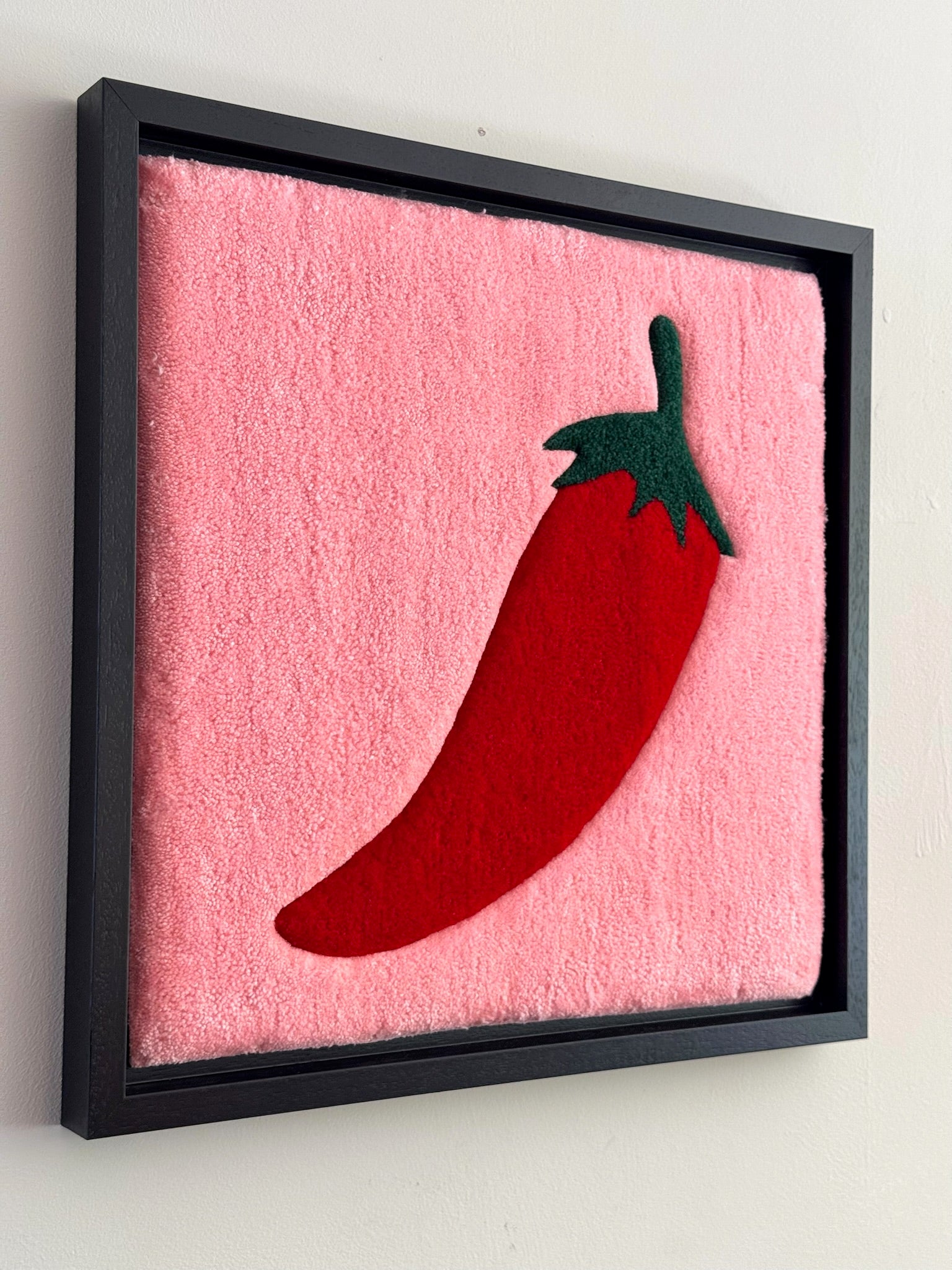 Hand-tufted wall art. Hot Chili red in wooden frame. 50x50 cm.